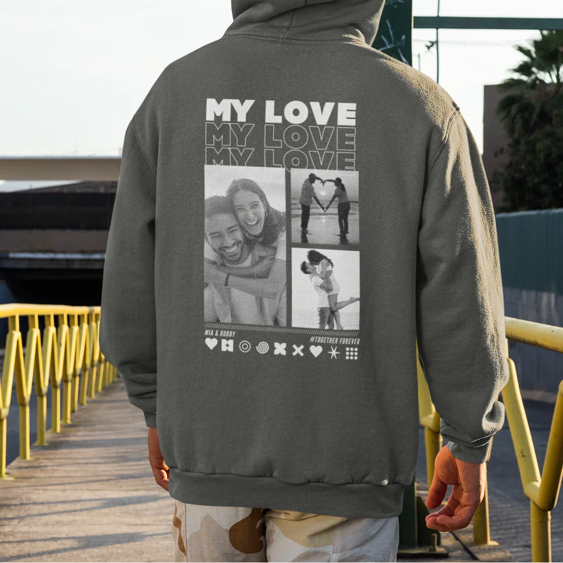 UrbanWarriorStore Hoodie Mockup: Rückansicht eines Manns mit personalisiertem My Love Hoodie auf Stadtstraße