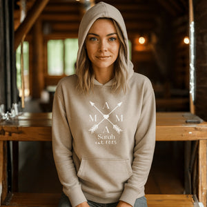 Beige hoodie with a “MAMA” design on the front.